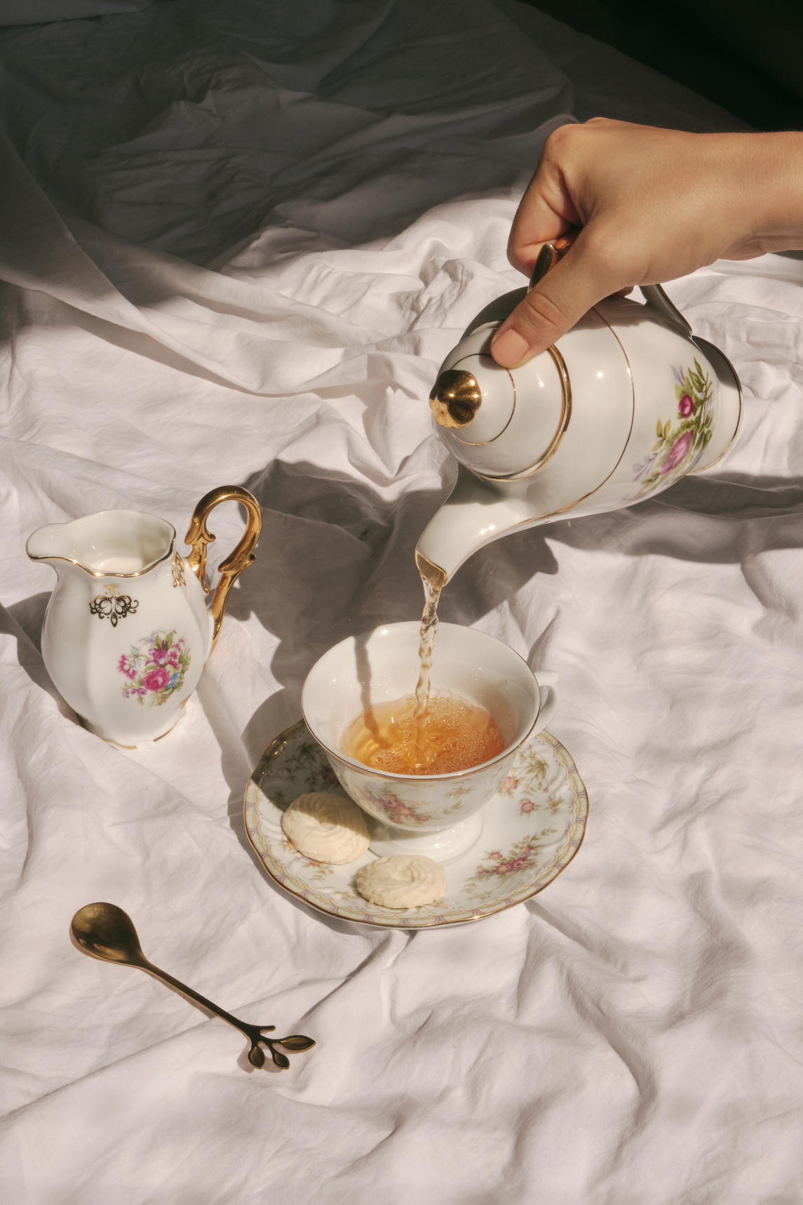 Pouring Tea on Tea Cup